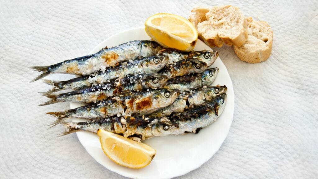 Espeto de sardinas is one of the typical dishes of Malaga that you have to try.