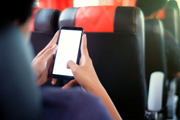 male-passenger-sitting-seat-bus-seat-using-his-phone_279756-20